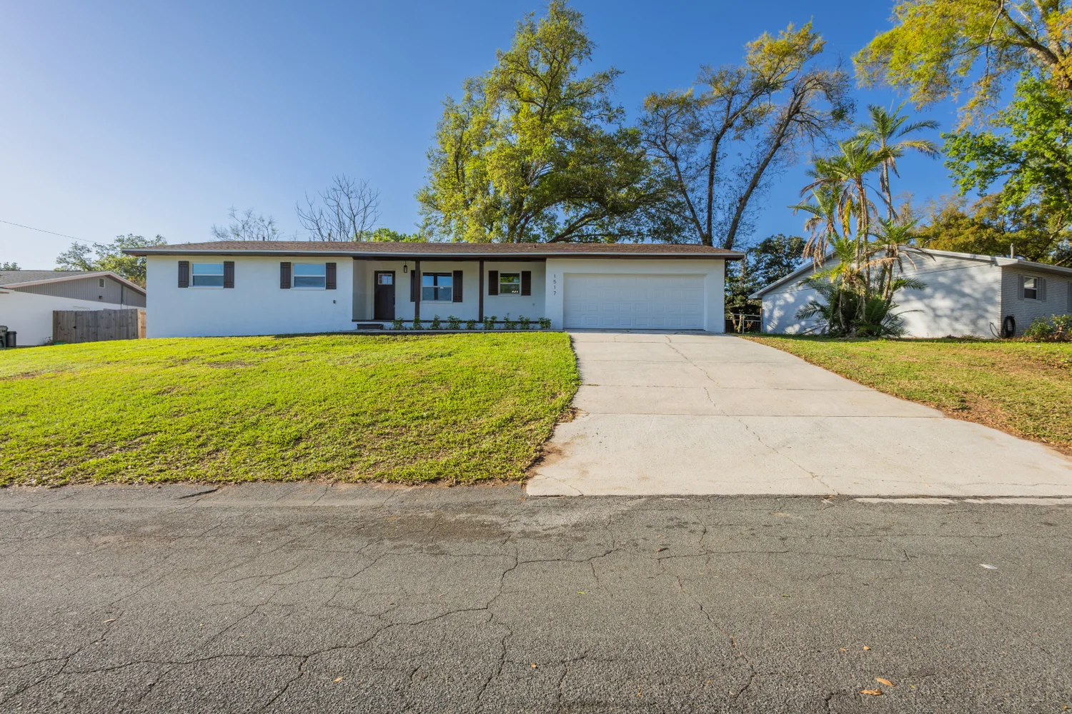 Single-story home with a wide driveway