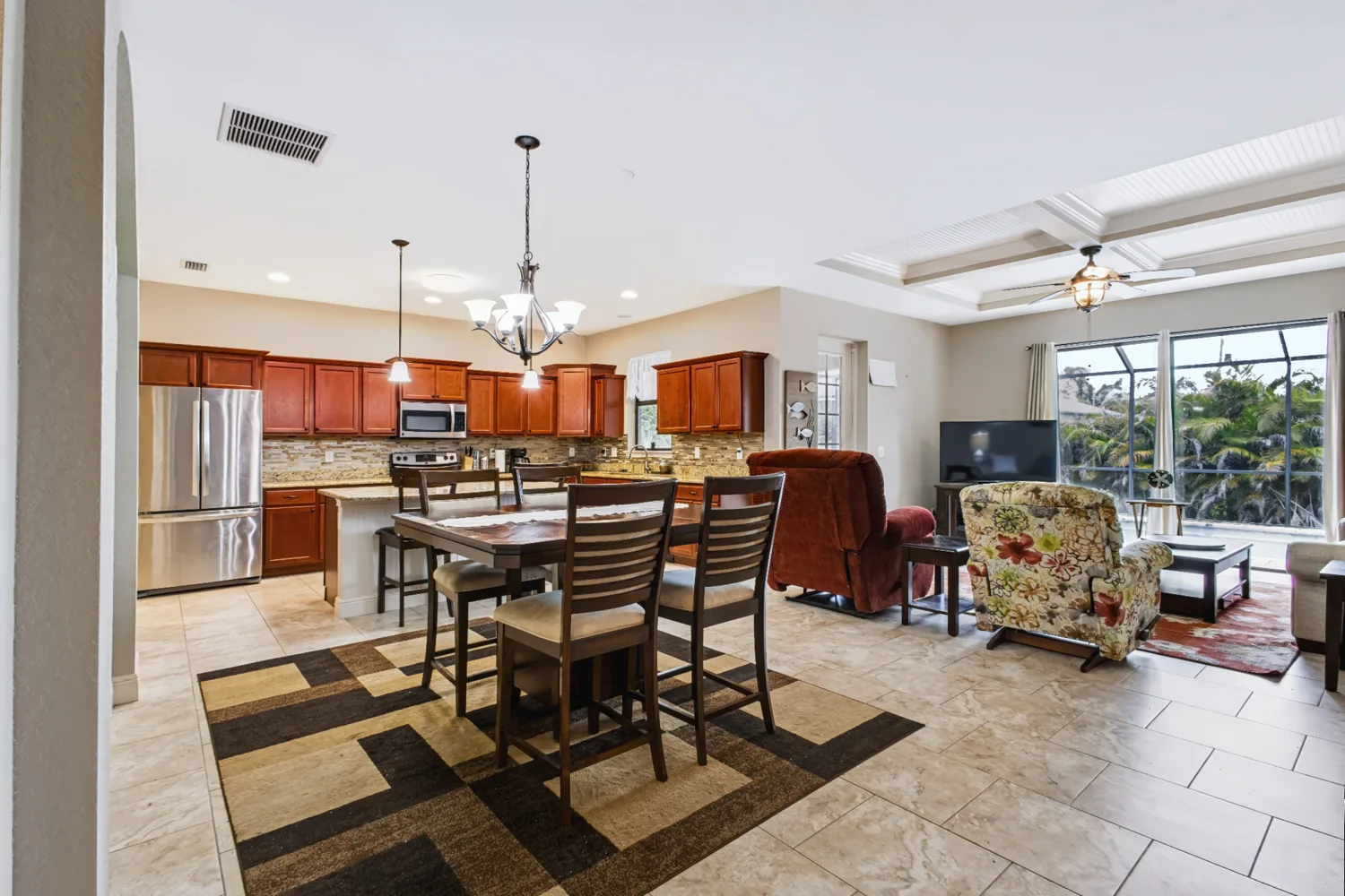 Kitchen and dining area with a view of the pool