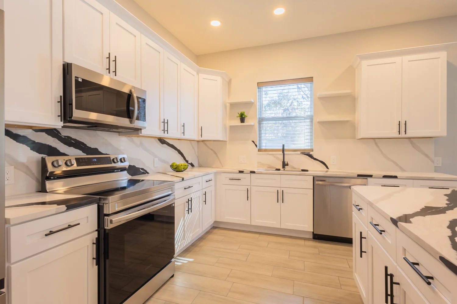 White kitchen with stainless steel appliances